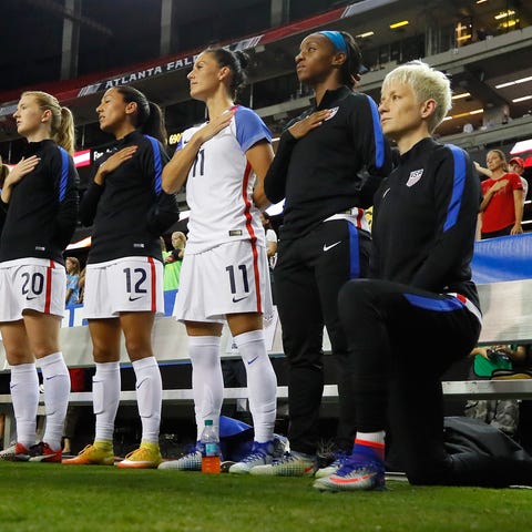 Megan Rapinoe kneels during the national anthem pr