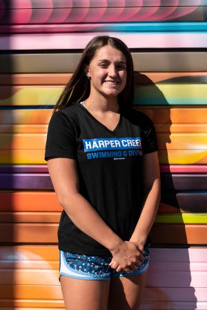Harper Creek graduating senior Alysa Wager stands for a picture on Thursday, June 11, 2020 in downtown Battle Creek, Mich. Wager became a two-time state champion in swimming in the same season and signed swim for Grand Valley State University.
