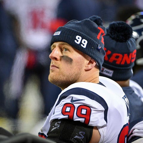 J.J. Watt sits on the sidelines during the fourth 