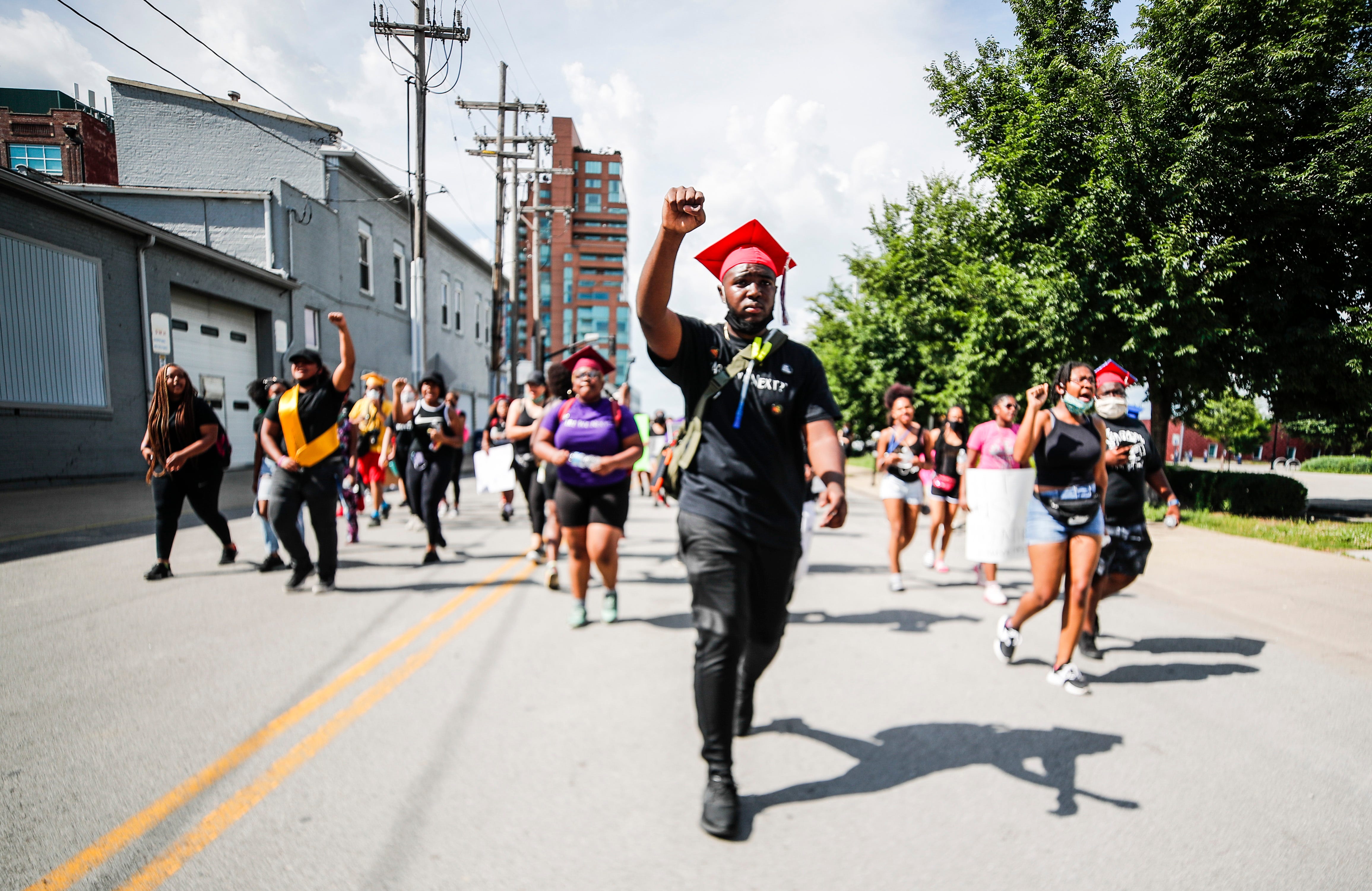 "We're marching for something bigger," said Savion Briggs, a 2020 Butler High grad. "Only way we're going to stop racism is solidarity. I shouldn't have to fear for my life just for the way I look." Briggs, among others, decided to wear their graduation caps as they marched and spoke for justice for slain EMT Breonna Taylor in Louisville.