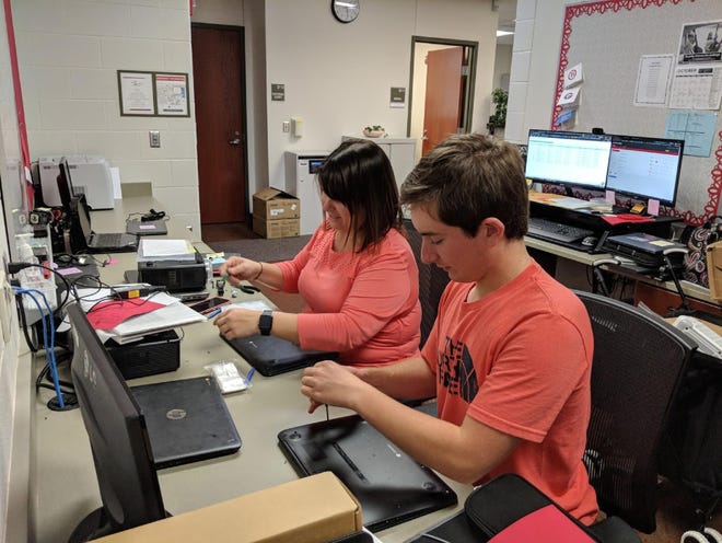 Port Clinton City School District Director of Learning Technologies, Chelsea Moyer, works with PCHS Senior Rok Scott as part of a Career Engagement Opportunity.  PCHS juniors and seniors can earn credit and career experience through this program and community partnerships.