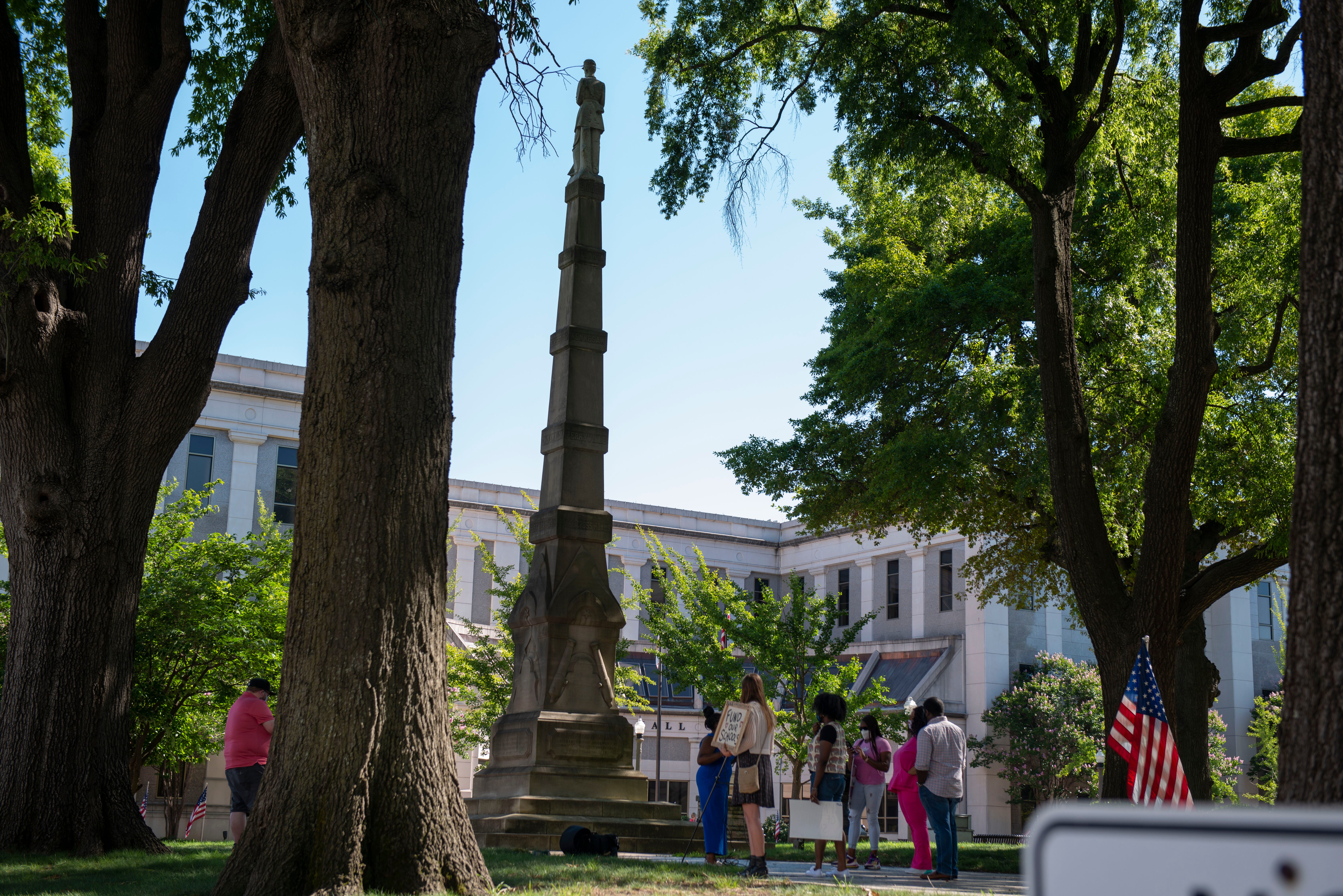 A small group protests in front of the Madison County Courthouse, Tuesday, June 16, 2020. Tracy Boyd organized the protest at a peaceful sit-in at the Madison County Courthouse.