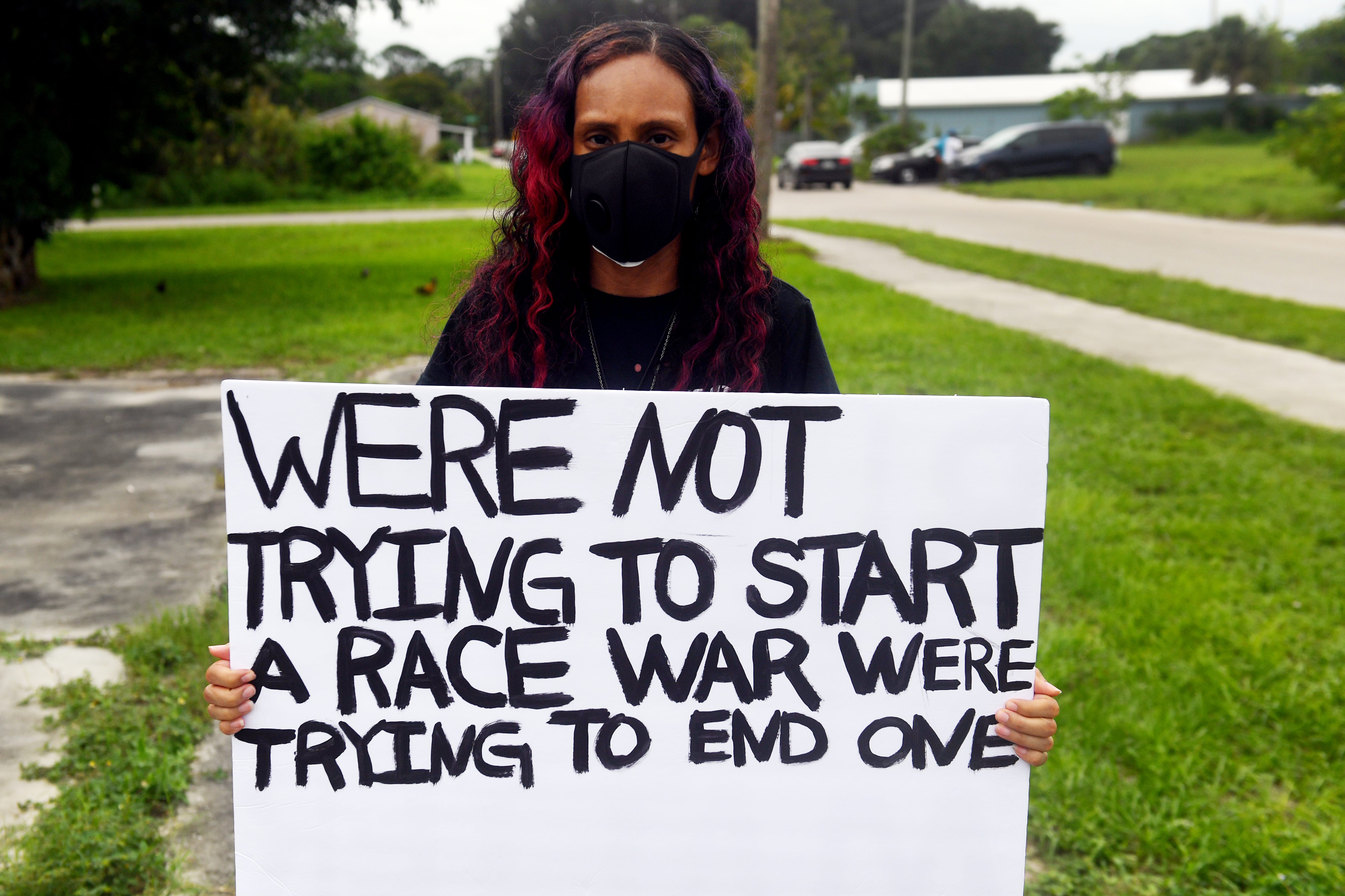 "For far too long the black community has suffered injustice at the hands of law enforcement," said Lasha Slappey, 34, of Indiantown, during a Black Lives Matters march Sunday, June 7, 2020, in Booker Park. "I'm marching to say enough is enough and we will no longer tolerate these crimes against us."