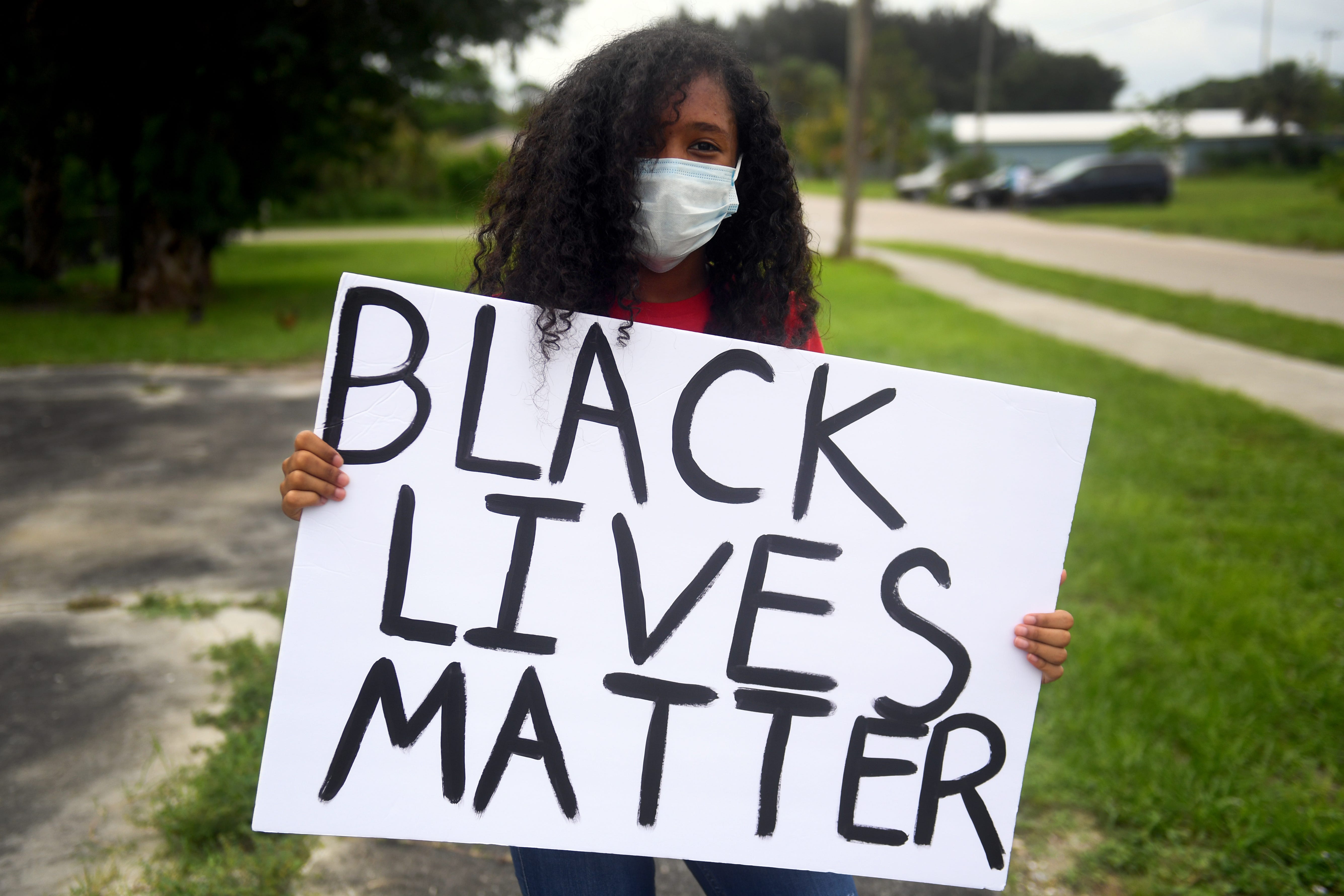 "I'm marching for my community, my family and my right to be treated equally," said Temazhen Slappey, 15, of Indiantown, during a Black Lives Matters march Sunday, June 7, 2020, in Booker Park.