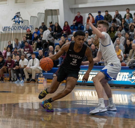 Rutgers Preps Trey Patterson No 3 drives to the basket against Gill St Bernards in February