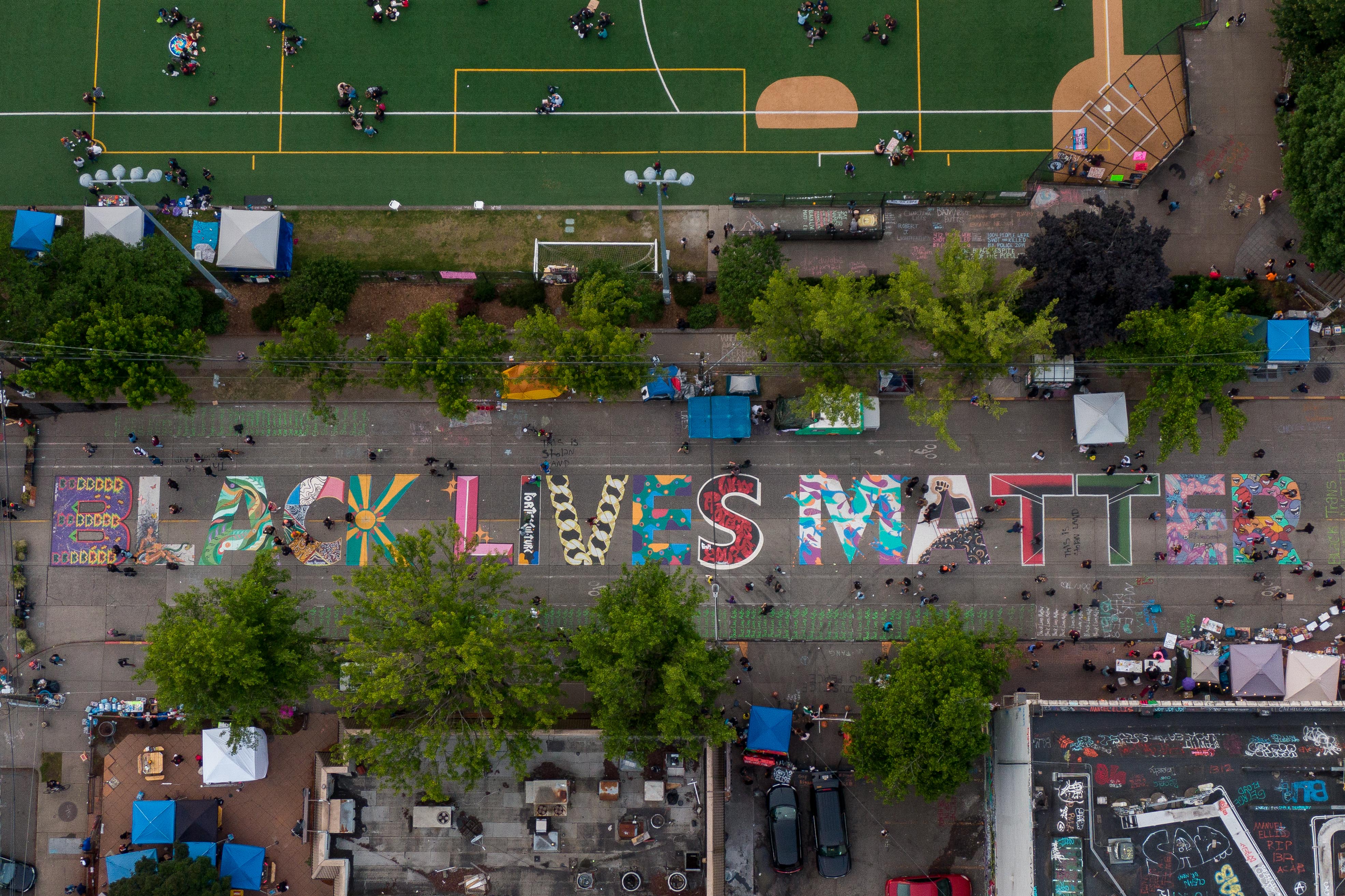 Teddy "Stat" Phillips contributed the letter I in a "BLACK LIVES MATTER" mural in Seattle.