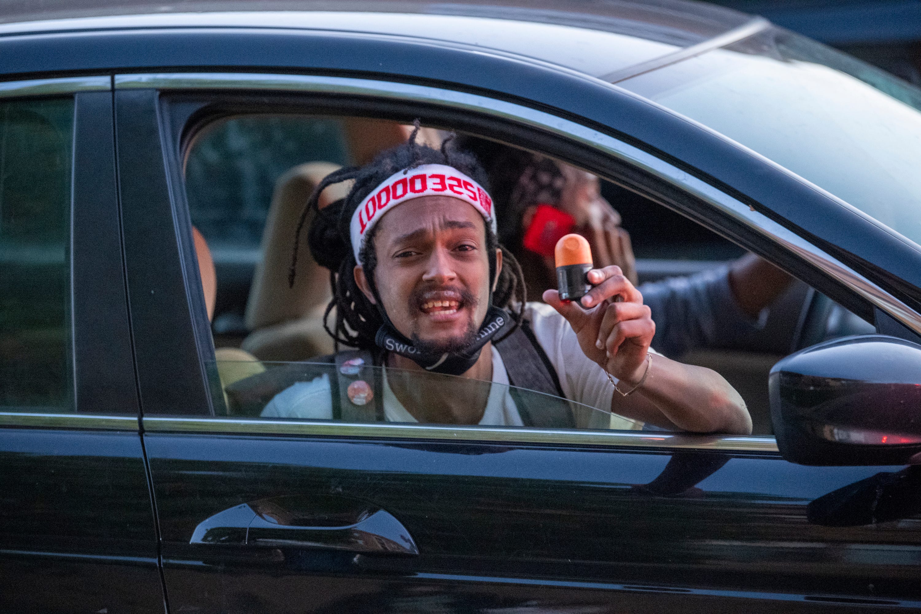 Robbie Tesfa of Minneapolis holds up a sponge round that was fired at protesters by police.