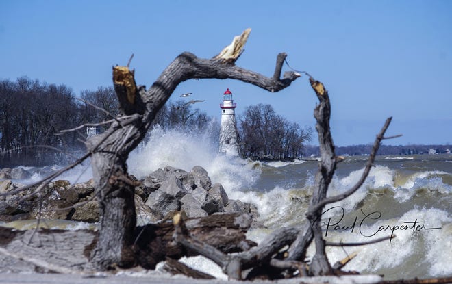 Paul Carpenter captured this shot of the Marblehead Lighthouse on a day when the lake was particularly angry. Carpenter uses a waterproof camera, which allows him to work in the midst of the elements.