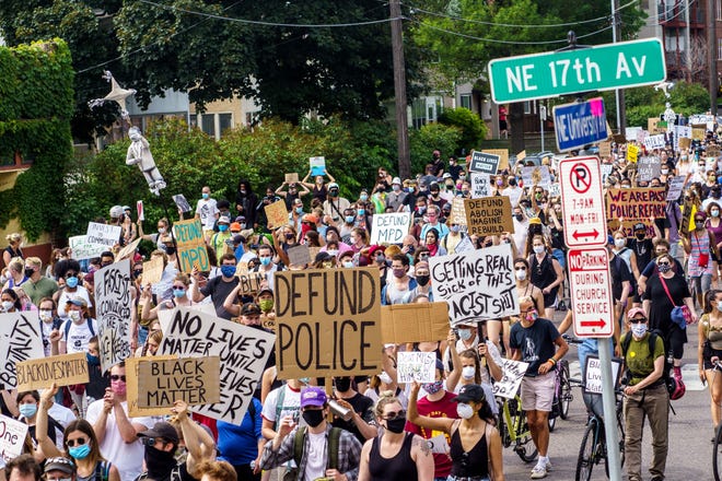 Demonstrators march against racism and police brutality and to defund the Minneapolis Police Department on June 6, 2020 in Minneapolis, Minnesota. - Demonstrations are being held across the US following the death of George Floyd on May 25, 2020, while being arrested in Minneapolis, Minnesota. (Photo by kerem yucel / AFP) (Photo by KEREM YUCEL/AFP via Getty Images)