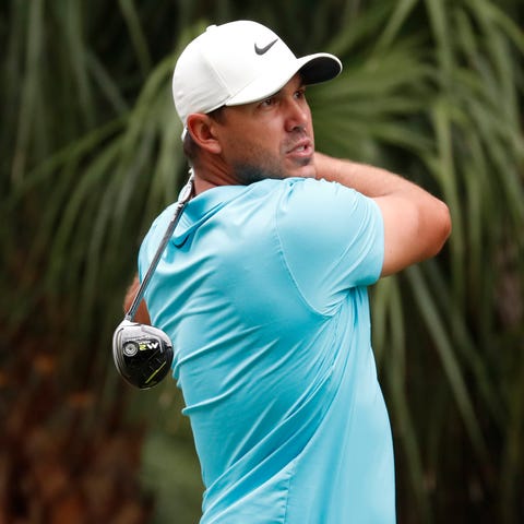 Brooks Koepka hits his tee shot on the 11th hole d