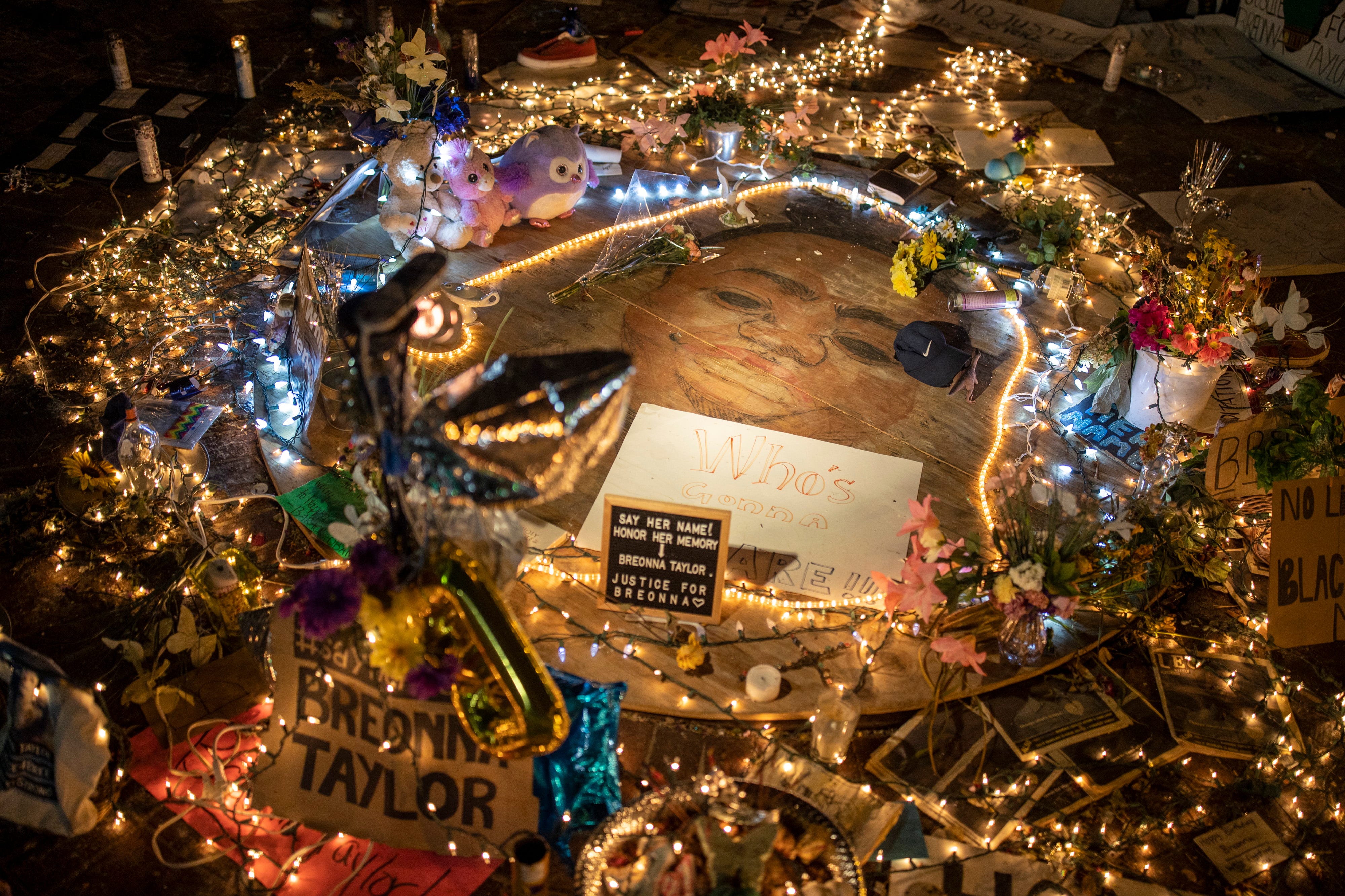 A portrait of Breonna Taylor is surrounded by tributes and lights in downtown Louisville, Ky., on June 18, 2020.