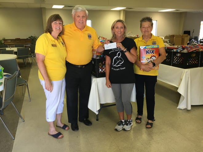 In early June, the Pike Road Lions Club donated $1,200 to the Woodland UMC Food Pantry. From left to right; Wendy Blackmon, Jimmy Lee, Stacy Dickinson, chairman of the food pantry, and Kitty Simpson.