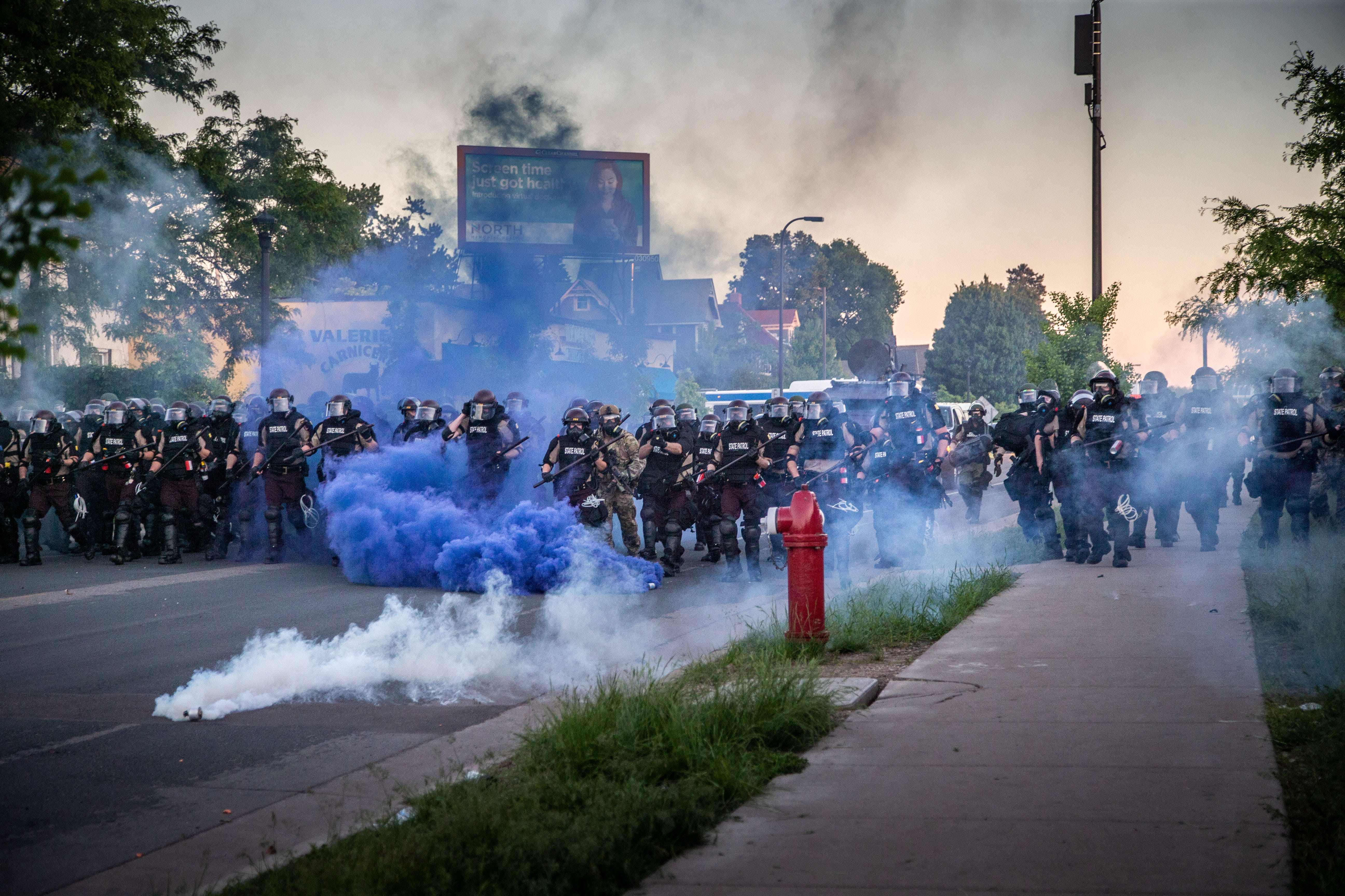 State patrol fire smoke and tear gas as they advance on protestors outside the fifth police precinct in Minneapolis  Saturday, May 30, 2020.