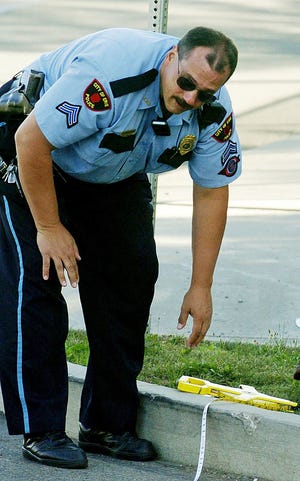 This is an August 2006 file photo of then-Cpl. Jeff Annunziata of the Erie Bureau of Police on the scene of a traffic accident in Erie, Pennsylvania.
