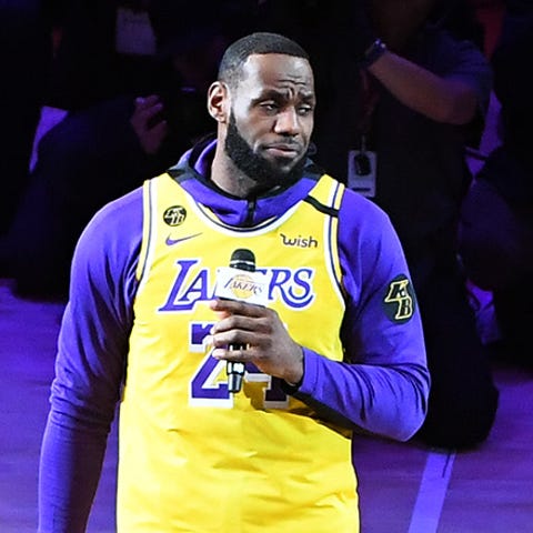 Lakers forward LeBron James (23) takes center cour