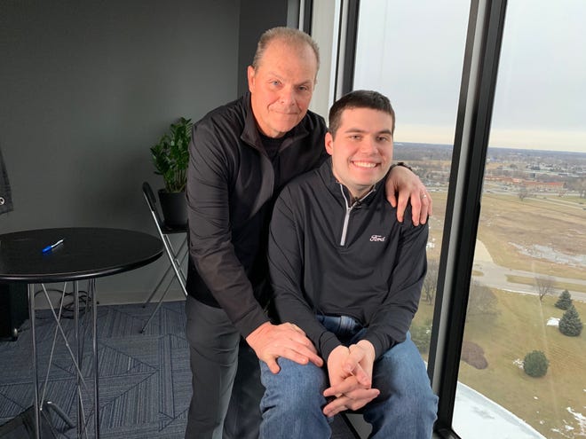 Mark LaNeve with his son, Drew, pictured here in 2019, is leaving his role as vice president of U.S. marketing, sales and service at Ford.