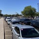 Cars stretch for several miles outside of Desert West Sports Complex waiting for testing, June 20 2020.