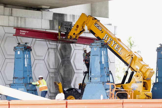 A crew from Beyel Brothers, Inc. puts in place the hydraulic lifts that will support the south span of the Roosevelt Bridge Monday, June 22, 2020, in Stuart. The six-lane, 23-year old bridge closed after a crack and falling concrete were discovered.