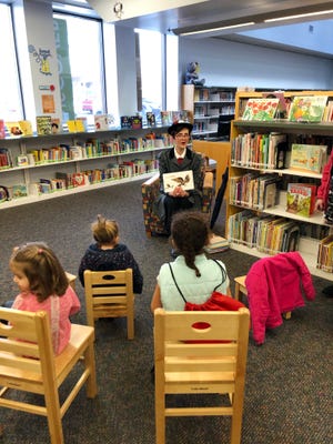 Christine Wagner, dressed as Mary Poppins, read books to children at the John McIntire Library during the Muskingum County Literacy Council’s “Leap into Literacy” event held on Leap Day to celebrate the introduction of the Dolly Parton Imagination Library to Muskingum County. The program provides free monthly books to any child, from birth to age 5.