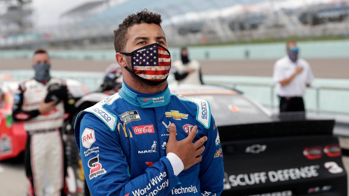 Driver Bubba Wallace stands for the national anthem prior to a NASCAR Cup series race in Miami on June 14.