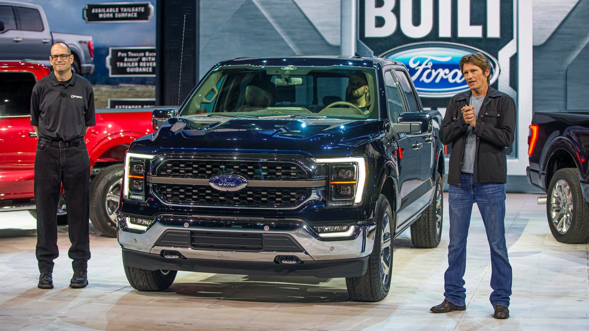 (Left) Todd Eckert, Ford Motor Co. truck group marketing manager, and Denis Leary, actor, philanthropist and F-150 reveal host, beside the all-new F-150 King Ranch in Antimatter Blue at the official reveal on June 25, 2020.