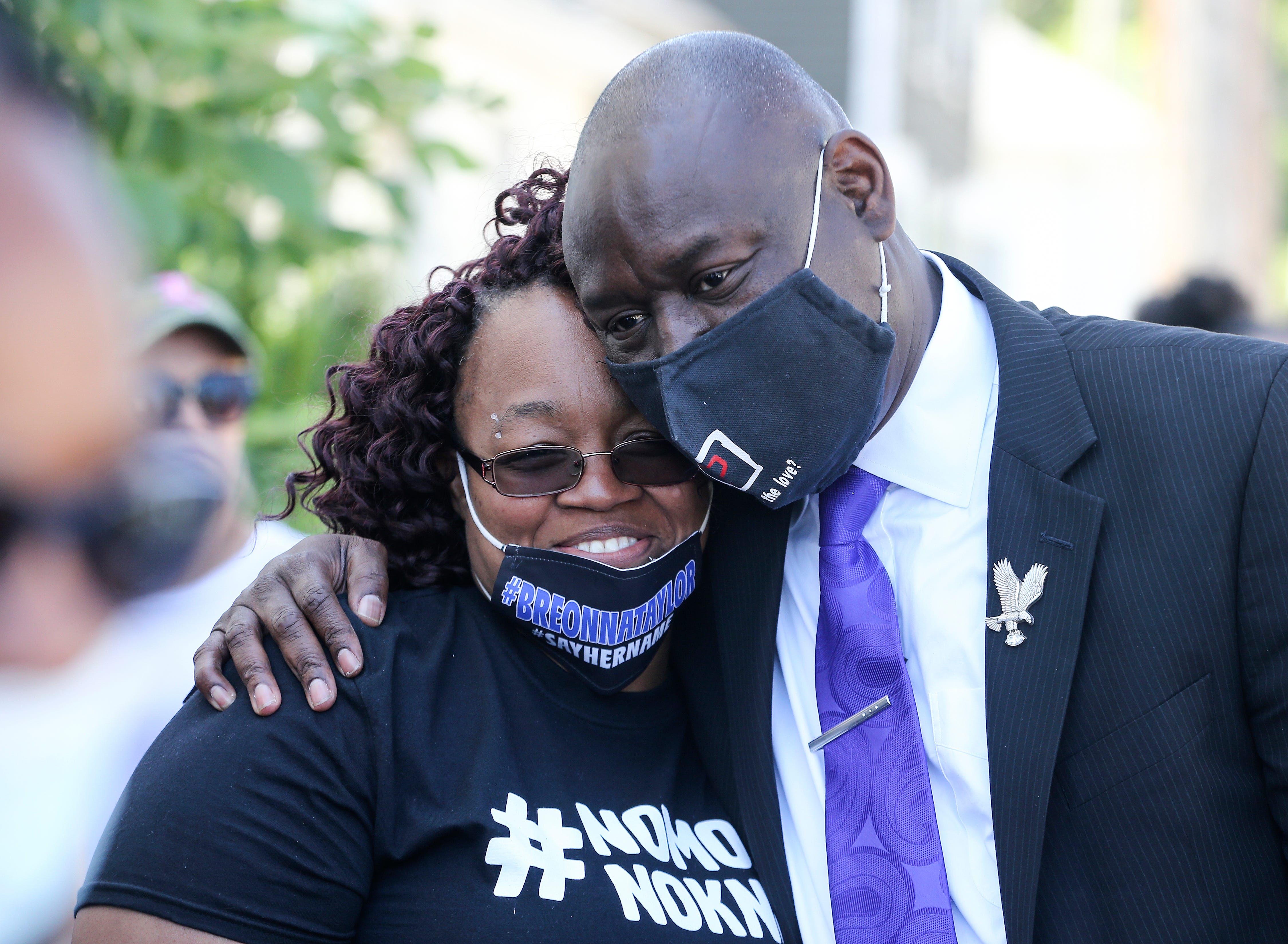 Tamika Palmer, mother of Breonna Taylor, who was killed by police, gets a hug from attorney Ben Crump before the start of a rally on the steps of the Kentucky State Capitol on Thursday, June 25, 2020.