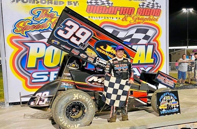 Dillsburg driver Anthony Macri poses in victory lane at Port Royal Speedway after won the sprint car feature on Saturday. Macri won his third straight race at the track on Wednesday night.