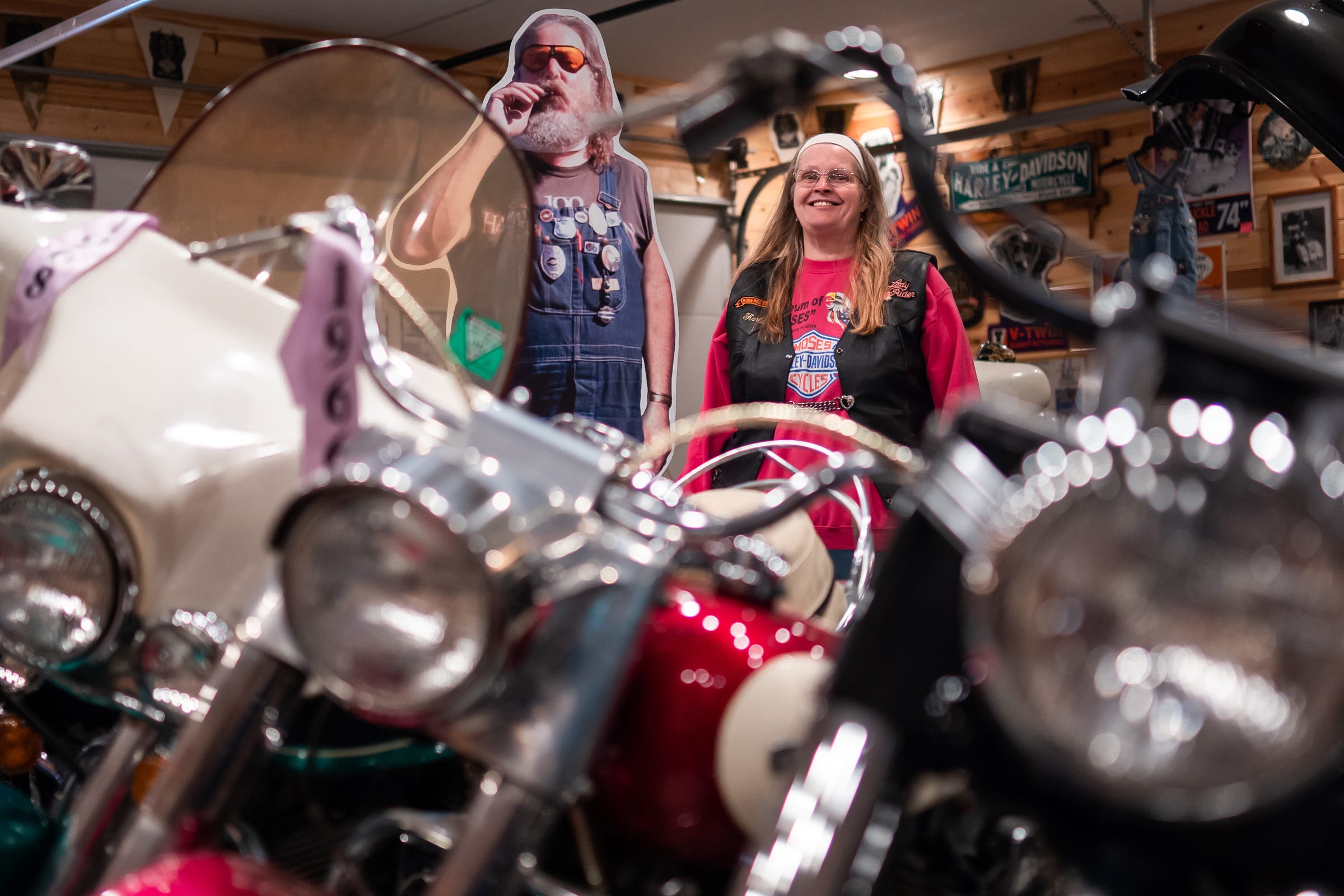 Karla Moses stands next to a cardboard cutout photo of her brother, the late Kevin Moses, inside the Museum of Moses in Vogel Center on Monday, June 15, 2020. 