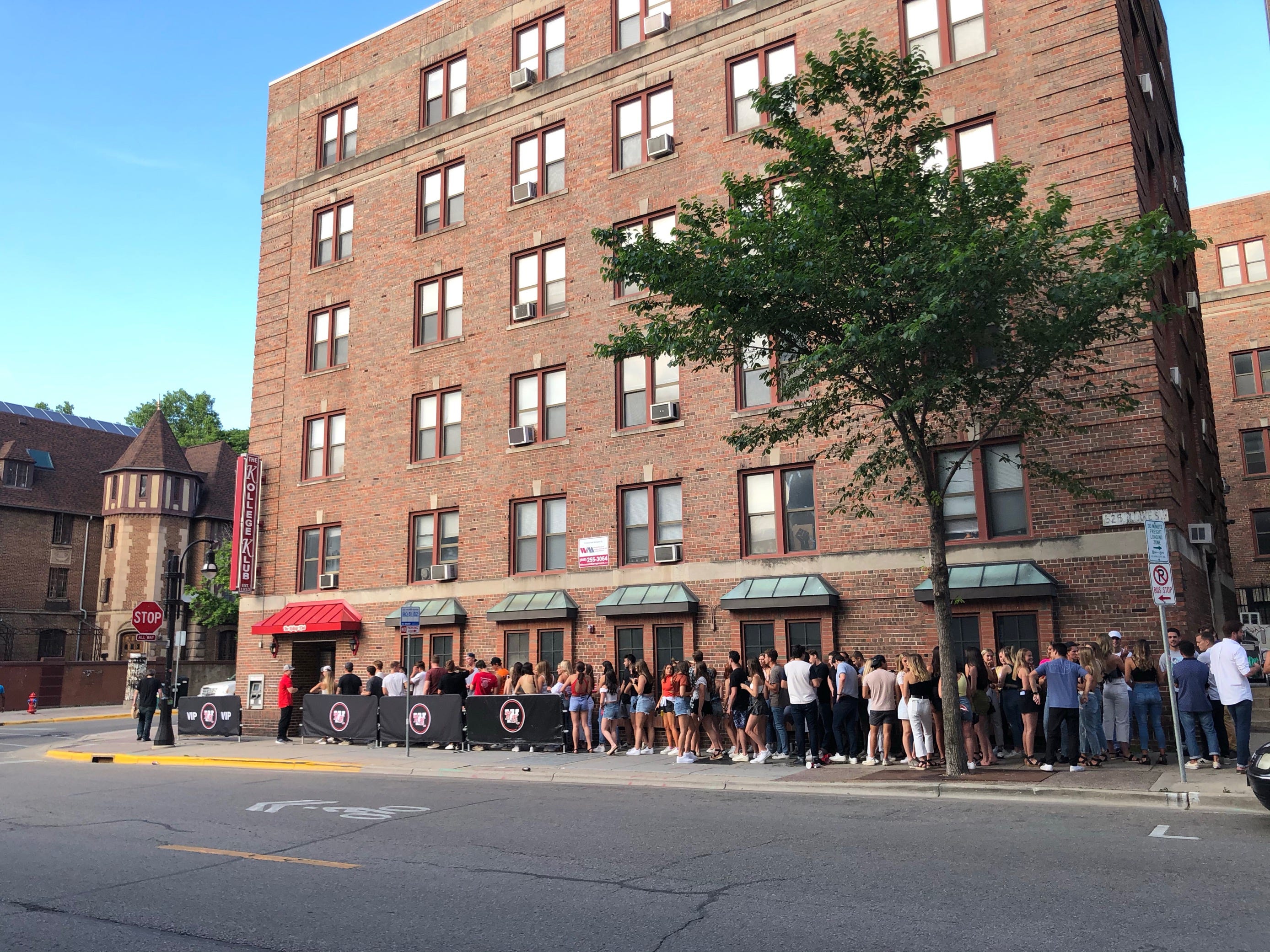 Bars in Madison have seen long lines as the city slowly reopened. Here, a line forms outside the Kollege Klub bar in Madison on Thursday, June 18. Dane County recently announced a sharp increase in new cases, with half of them affecting people in their 20s.