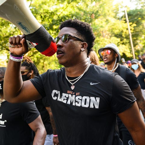 Clemson's K.J. Henry and other football players le