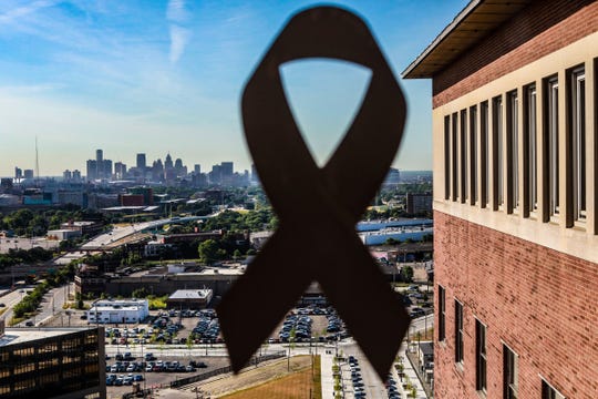 Walking through the Henry Ford Hospital in Detroit, white ribbons decorate the window to thank essential medical workers like Dr. Rana Awdish. The Detroit downtown skyline can be seen, photographed on May 26, 2020.
