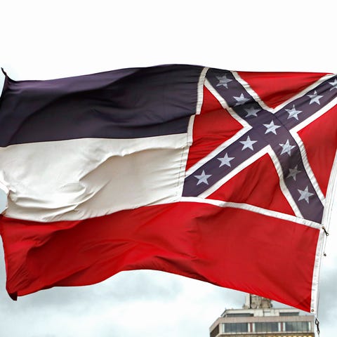 A Mississippi state flag flies outside the Capitol