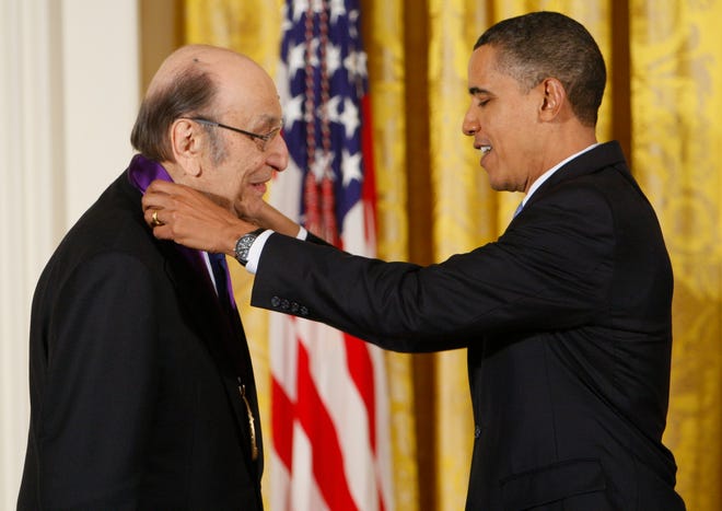 In this Thursday, Feb. 25, 2010, file photo, President Barack Obama presents a 2009 National Medal of Arts to Milton Glaser, in the East Room of the White House in Washington.