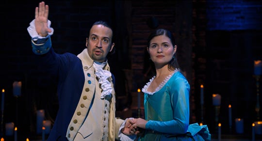 Lin-Manuel Miranda stars as Alexander Hamilton and Phillipa Soo is Eliza Hamilton in "Hamilton," the filmed production of the Broadway musical available on Disney+.