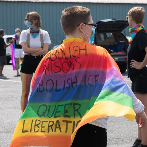 Jen Herman wears a rainbow cape to the Pride Carav