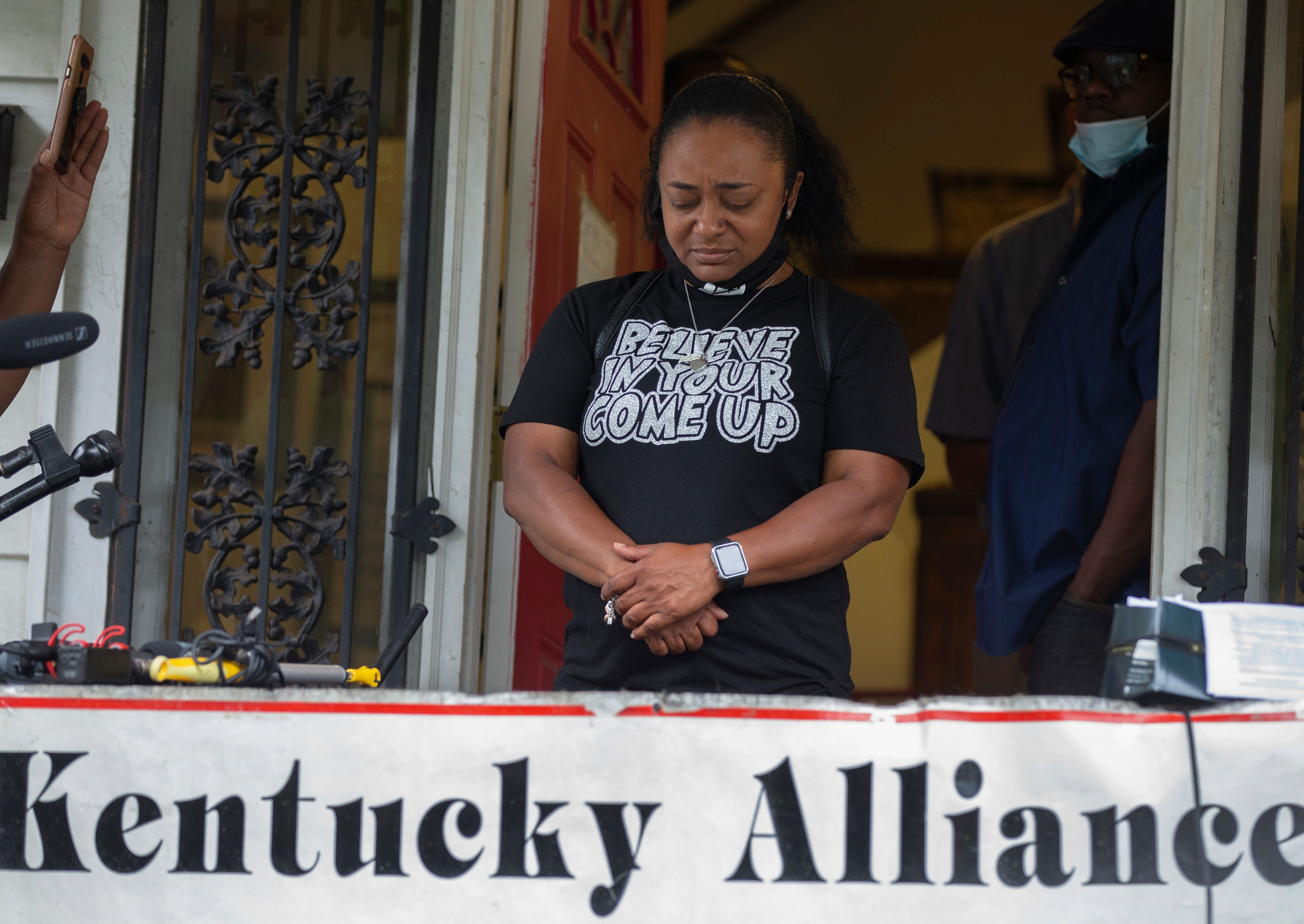 Tyra Walker of the Kentucky Alliance Against Racism and Poltical Oppression holds back tears as she addresses the shooting of a man at the camp of protesters at Jefferson Square Park. June 28, 2020