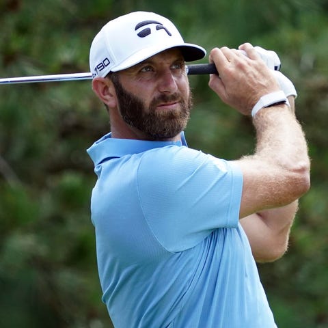 Dustin Johnson plays his shot from the fifth tee d