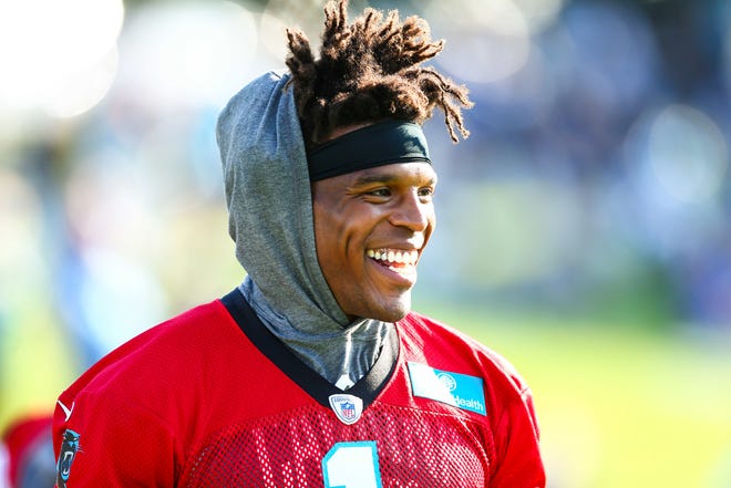 Former Carolina Panthers quarterback Cam Newton (1) smiles during training camp held at Wofford College before the 2019 NFL season.