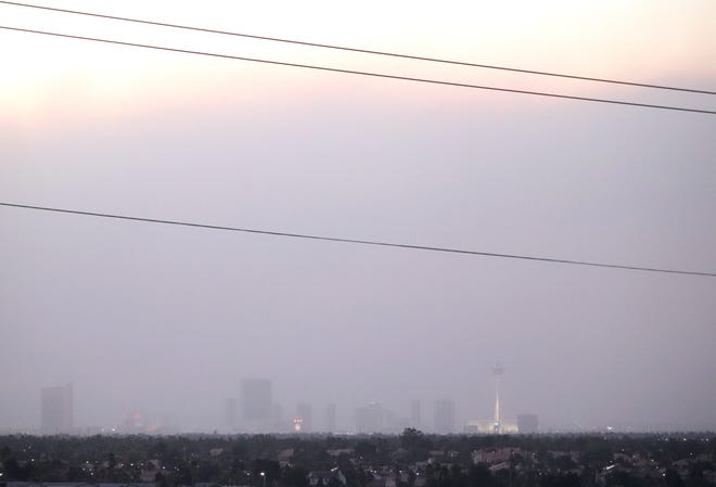 Dust and smoke from the Mahogany Fire made the Strip barely visibly Sunday night.