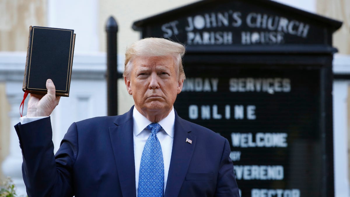 In this Monday, June 1, 2020 file photo, President Donald Trump holds a Bible as he visits outside St. John's Church across Lafayette Park from the White House.