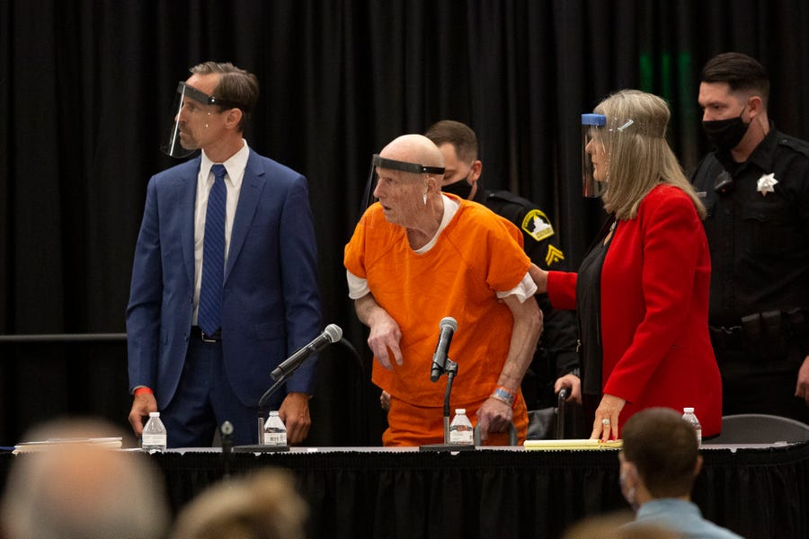 Joseph James DeAngelo, arrested in 2018 over crimes committed by the Golden State Killer, wears a face shield in a makeshift courtroom in a Sacramento State University ballroom June 29.