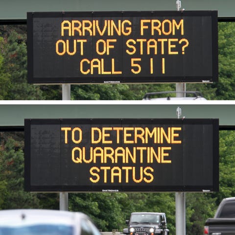 A quarantine reminder sign along Route 195 eastbou