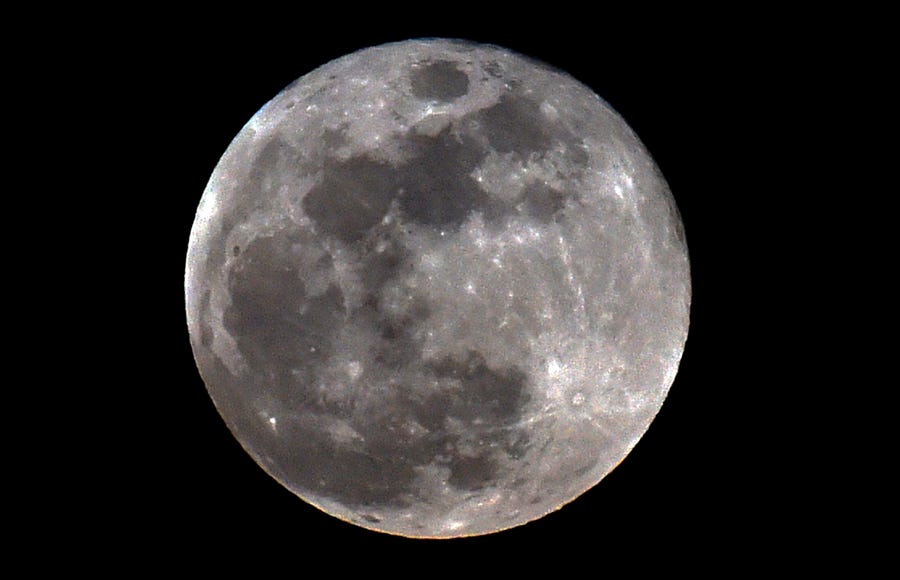 The full moon is seen during a penumbral lunar eclipse in Mexico City on June 5, 2020.