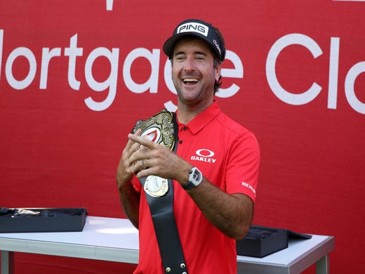 Bubba Watson poses with the champions belt after being a winner of the Rocket Mortgage Classic's 'Changing the Course' charity golf event, 12-time PGA TOUR winner and two-time Masters champion Bubba Watson and Harold Varner III versus former World No. 1 Jason Day and Wesley Bryan nine-hole exhibition at Detroit Golf Club, July, 1, 2020.