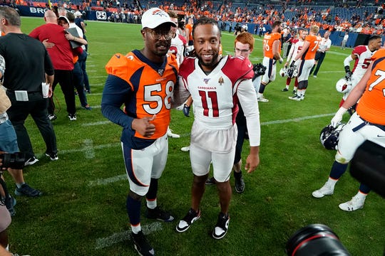 Broncos linebacker Von Miller (58) greets Cardinals receiver Larry Fitzgerald (11) after an NFL preseason game last year.