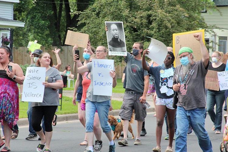 People walk down North Third Street in Barron on Thursday, June 4, in support of the Black Lives Matter movement.