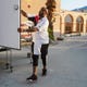 Coachella Valley Rescue Mission employee Charles Dangerfield III closes the door to the portable shower used by guest staying at the emergency overnight shelter at Palm Springs High School in Palm Springs, Calif., on June 26, 2020. The overnight shelter will be relocating. 