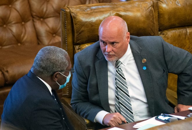 A lack of consistency regarding mask wearing is often seen in the Mississippi Legislature. Here, Sen. John Horhn, D-Jackson, left, wears a mask as he confers with Rep. Donnie Bell, R-Fulton, at the Capitol in Jackson, Miss., June 29, 2020.