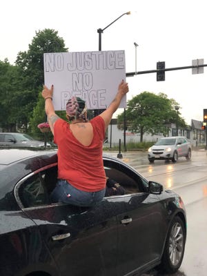A Menomonee Falls protester participates in a Break the Silence in the Burbs marchin June. After the summer of protests, rallies and marches in Menomonee Falls and the other suburbs, Menomonee Falls 2020 graduate Robyn George started a nonprofit organization called Suburbs for Equality.
