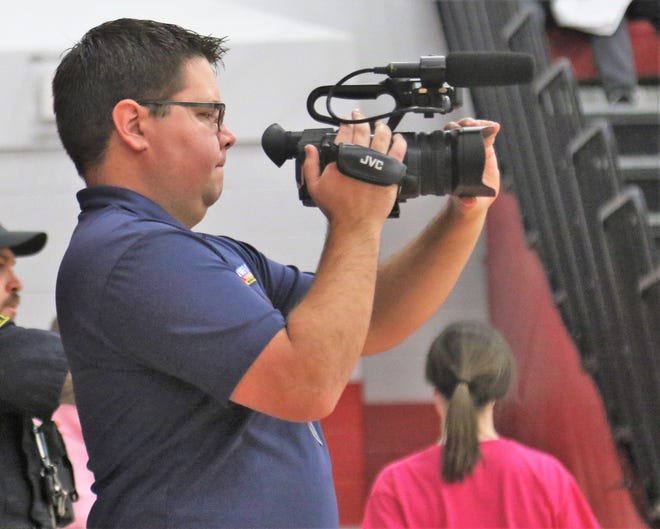 Local TV personality Travis Berardi films a game at Shelby High School during the 2019-20 high school basketball season.